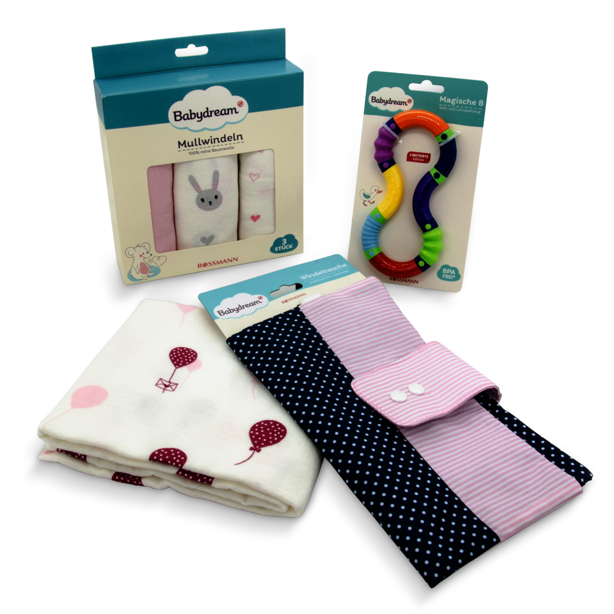 Das Foto zeigt drei Produktverpackungen aus dem Bereich Windeln, Spielzeug, Zubehör der Rossmann-Eigenmarke Babydream.